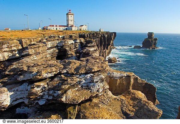 Lighthouse and Cliffs at Atlantic Coast. Carvoeiro cape. Peniche. Estremadura. Portugal.