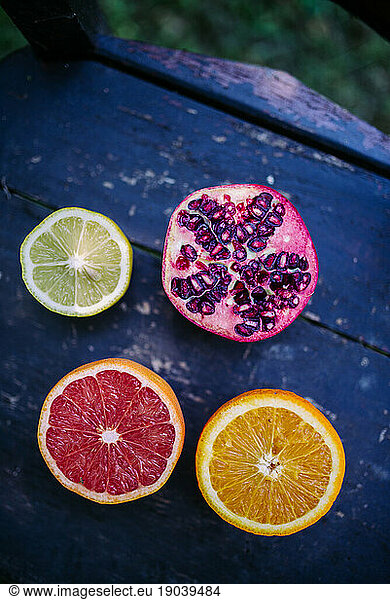 Lime  pomegranate  red and natural orange on the rustic chair.