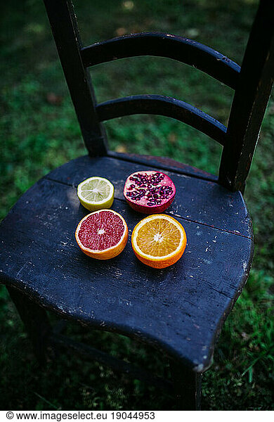 lime  pomegranate  red and natural orange on the rustic chair.