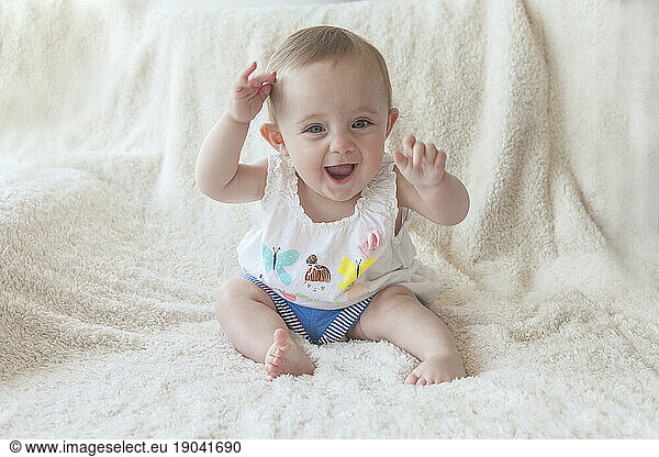 Little baby girl having fun at home.