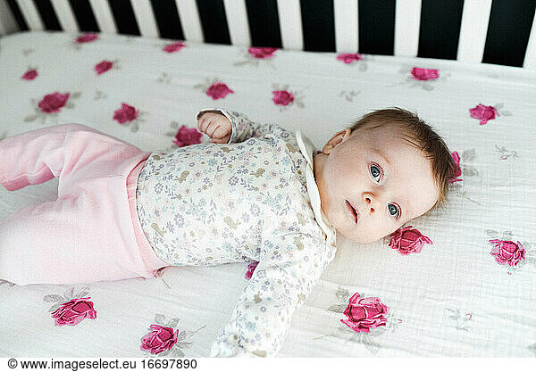 Little baby girl in her crib