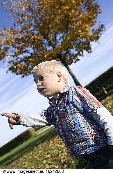 Little boy (2-3 years) gesturing,  portrait