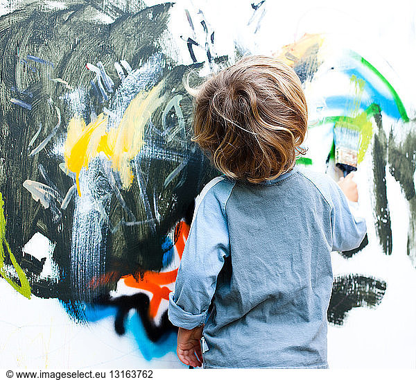 Little boy painting