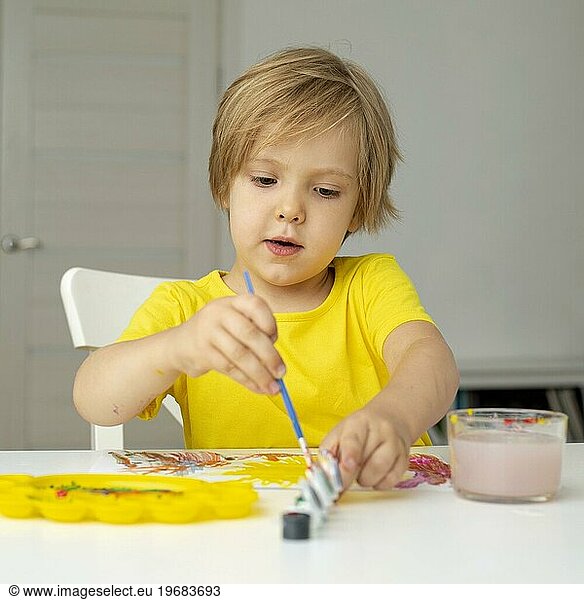 Little boy painting