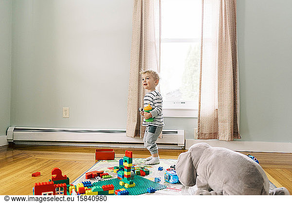 Little boy playing in his playroom.
