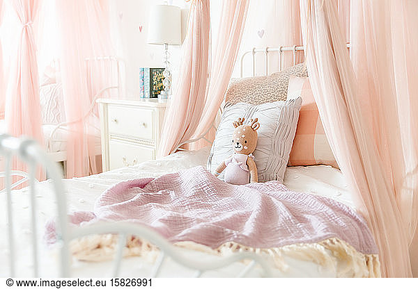 Little girl bed with stuffed animal