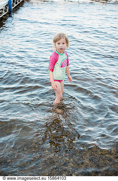Little girl cooling off at the lake.