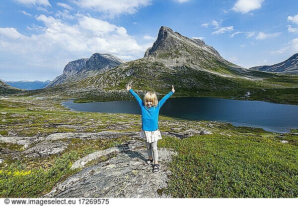 Little girl enjoying the view over a glacial valley  Trollstigen mountain road  Norway  Europe