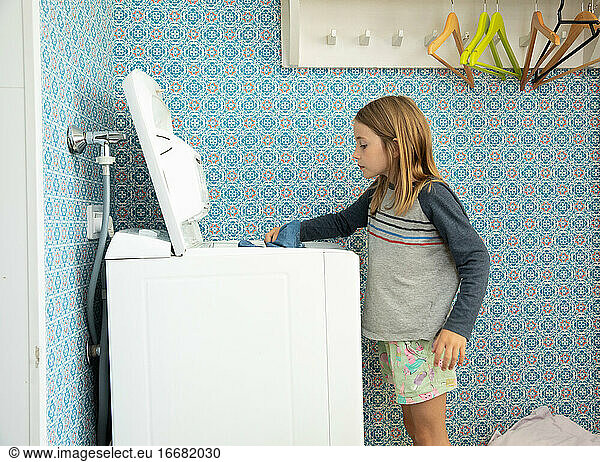 Little Girl Helping With Laundry in Helsinki  Finland