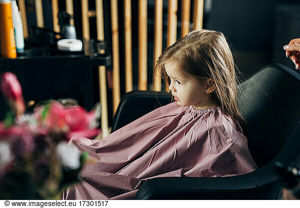 Little girl in the barbershop