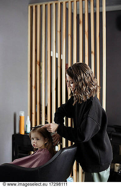 Little girl in the barbershop