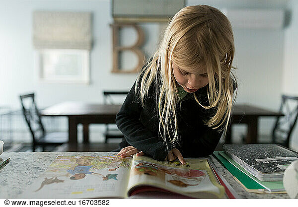 Little girl learning to read