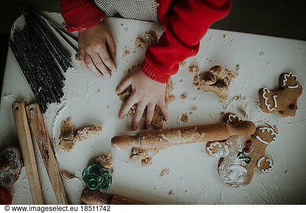 Little Girl Playing With Dough. Above view.