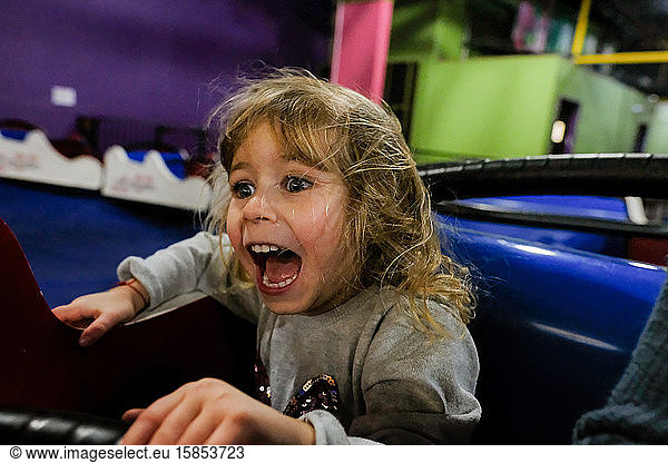 little girl screaming on amusement park ride