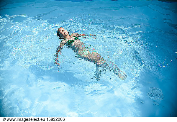 Little girl swimming in the pool