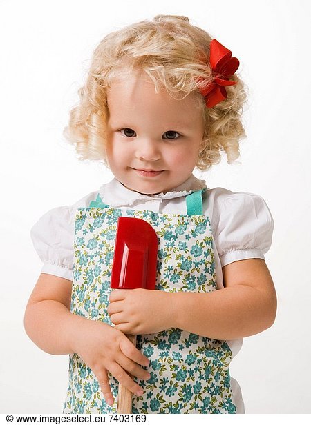 little girl with a spatula.