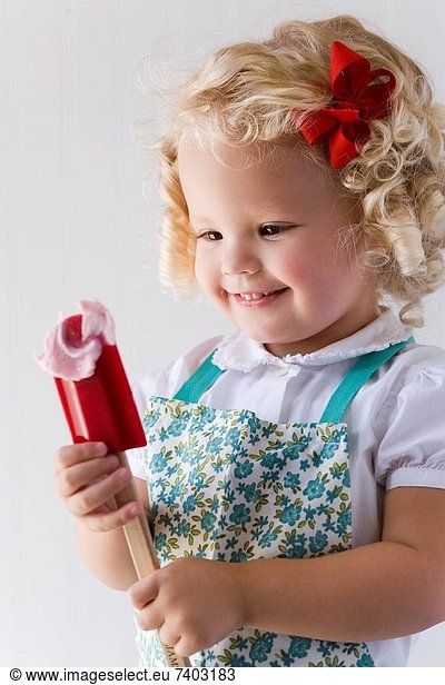little girl with a spatula.