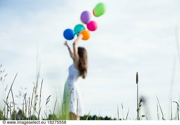 Little girl with balloons. Summer holidays  celebration  children happy little girl with colorful balloons. Portrait of a happy teenager or preteen. Child's birthday party  celebrate  holiday