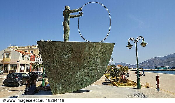 Lixouri  harbour promenade  bronze sculpture  sideways  man with big tyre  lantern  blue cloudless sky  Kefalonia Island  Ionian Islands  Greece  Europe