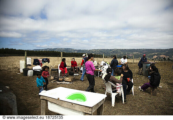 Local Chilean people gather outdoors  and attempt to resume normal life after the devastating earthquake and subsequent tsunami that hit the country in early 2010.