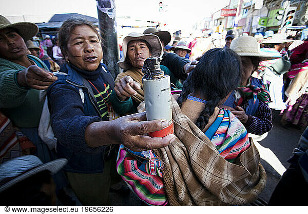 Local people in Oruro  Bolivia hold up a gas canister used against their protest in the streets.