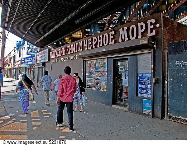 Local Russian immigrants walk past a Russian-language book store in the ´Little Odessa´ neighborhood of Brighton Beach in Brooklyn  New York The area is largely populated by Russian immigrants