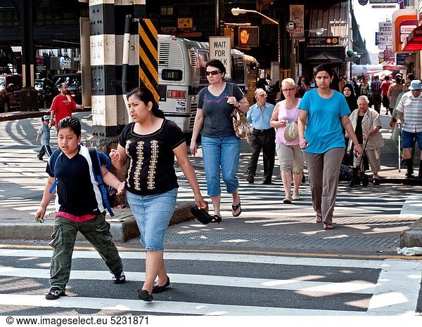 Locals of many ages cross Coney Island Avenue in the ´Little Odessa´ neighborhood of Brighton Beach in Brooklyn  New York The area is largely populated by Russian immigrants