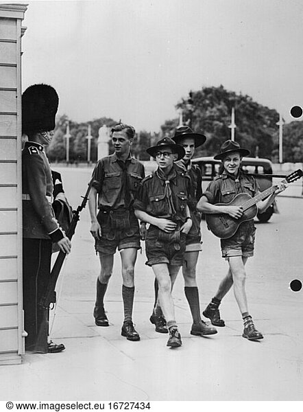 London  England. German boy scouts in London  Looking a Buckingham Palace Guard. Photo  1951.