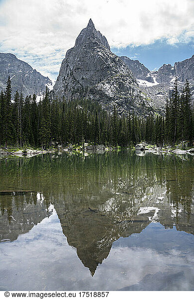 Lone Eagle Peak reflecting in glassy pond