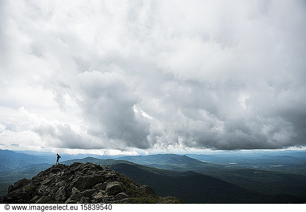 Lone hiker on mountain ridgeline