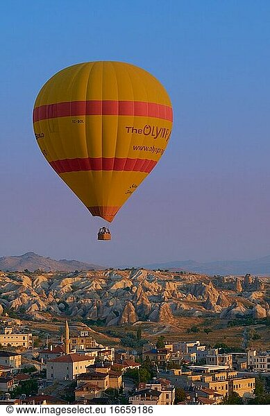 Lonely hot air balloon fly in the morning over Goreme in Cappadocia  Turkey.