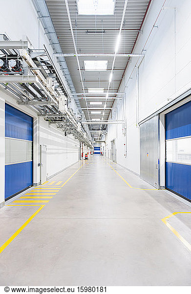Long corridor in empty factory