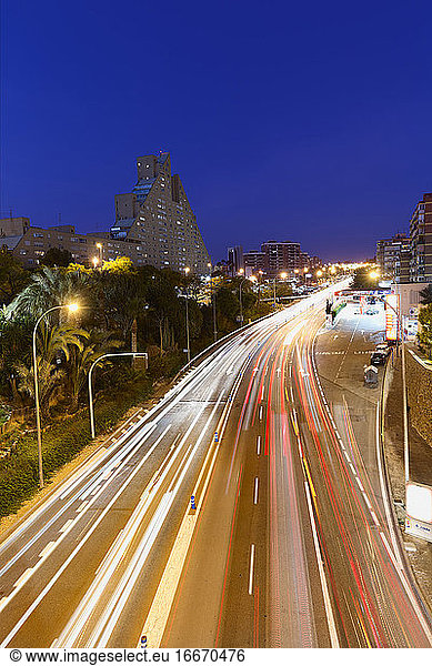 Long exposure dusk in a street with enough traffic in Alicante.