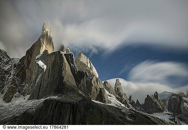 Long exposure of clouds forming around Cerro Torre  illuminated