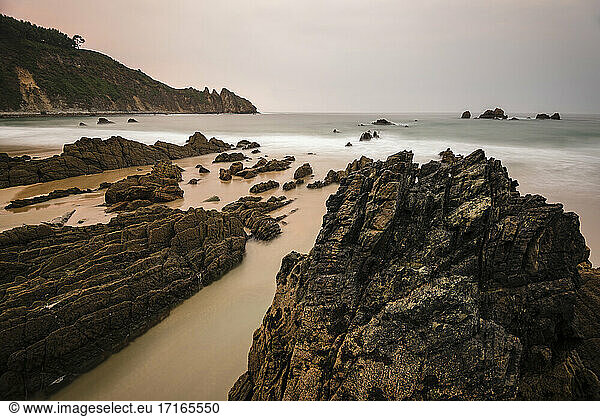Long exposure of coastal beach at dusk  Asturias  Spain