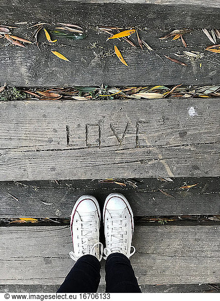Look from above  Love engraved in wood floor
