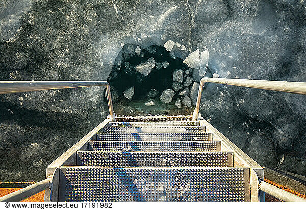 Looking Down The Frozen Steps Of A Ladder Into Ice Blocks in Denmark