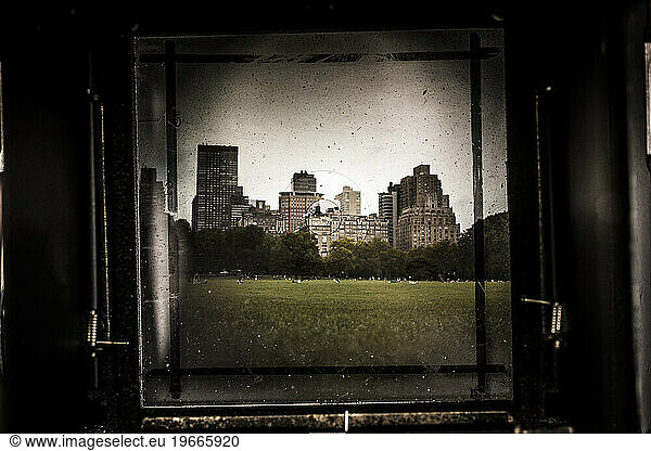 Looking through the viewfinder of a vintage camera at Central Park