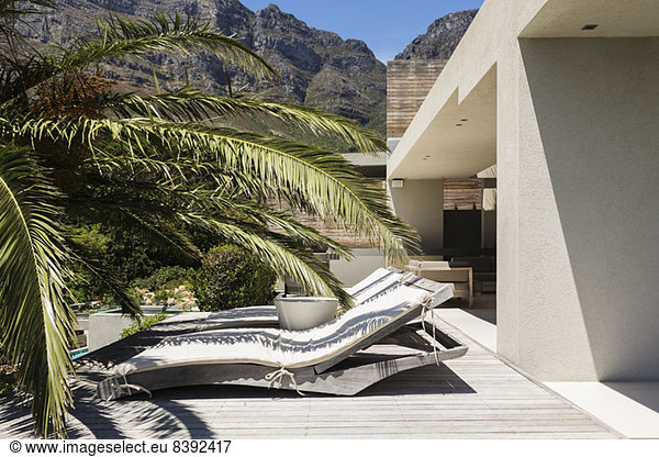 Lounge chairs outside modern house