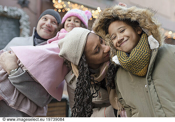 Loving family together enjoying at Christmas market