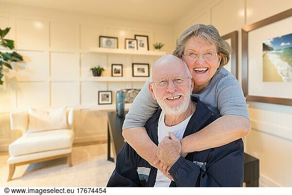 Loving senior couple inside their home office