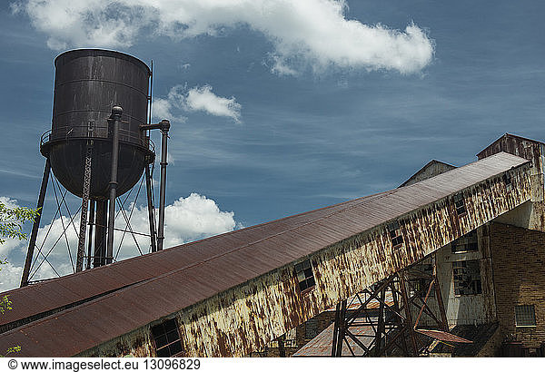 Low angle view of buildings against blue sky at Missouri Mines State Historic Site