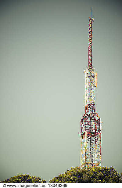 Low angle view of communication tower against clear sky