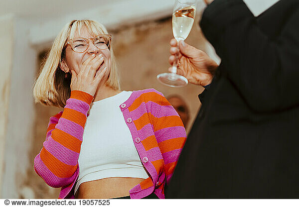 Low angle view of happy businesswoman laughing during event at convention center