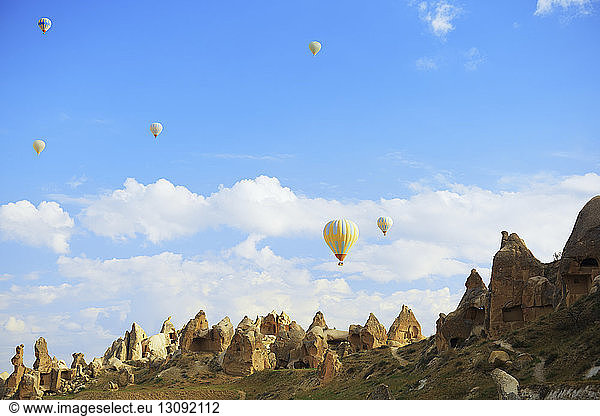 Low angle view of hot air balloons over Cappadocia