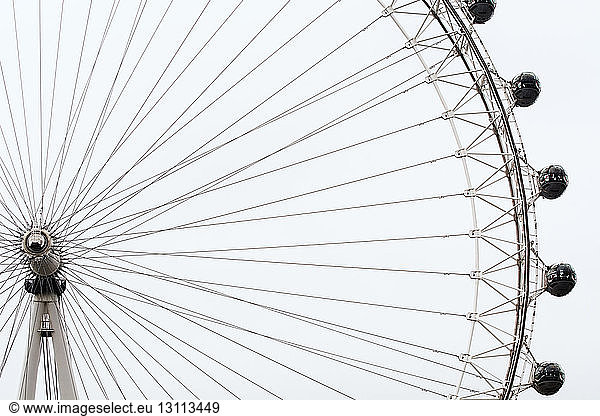 Low angle view of London Eye against clear sky
