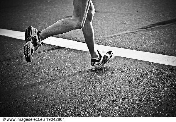 Low angle view of runners legs during the Herndon Festival 5/10K race held in Herndon  VA.
