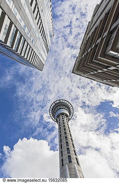 Low angle view of Sky Tower against cloudy sky in Auckland  New Zealand