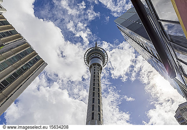 Low angle view of Sky Tower against cloudy sky in city  Auckland  New Zealand