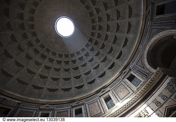 Low angle view of sunlight falling from hole at Pantheon